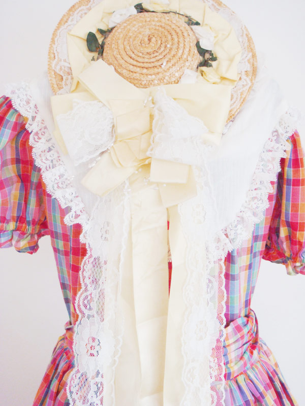 Vintage bonnet and cute gingham dress available at Beyond Retro